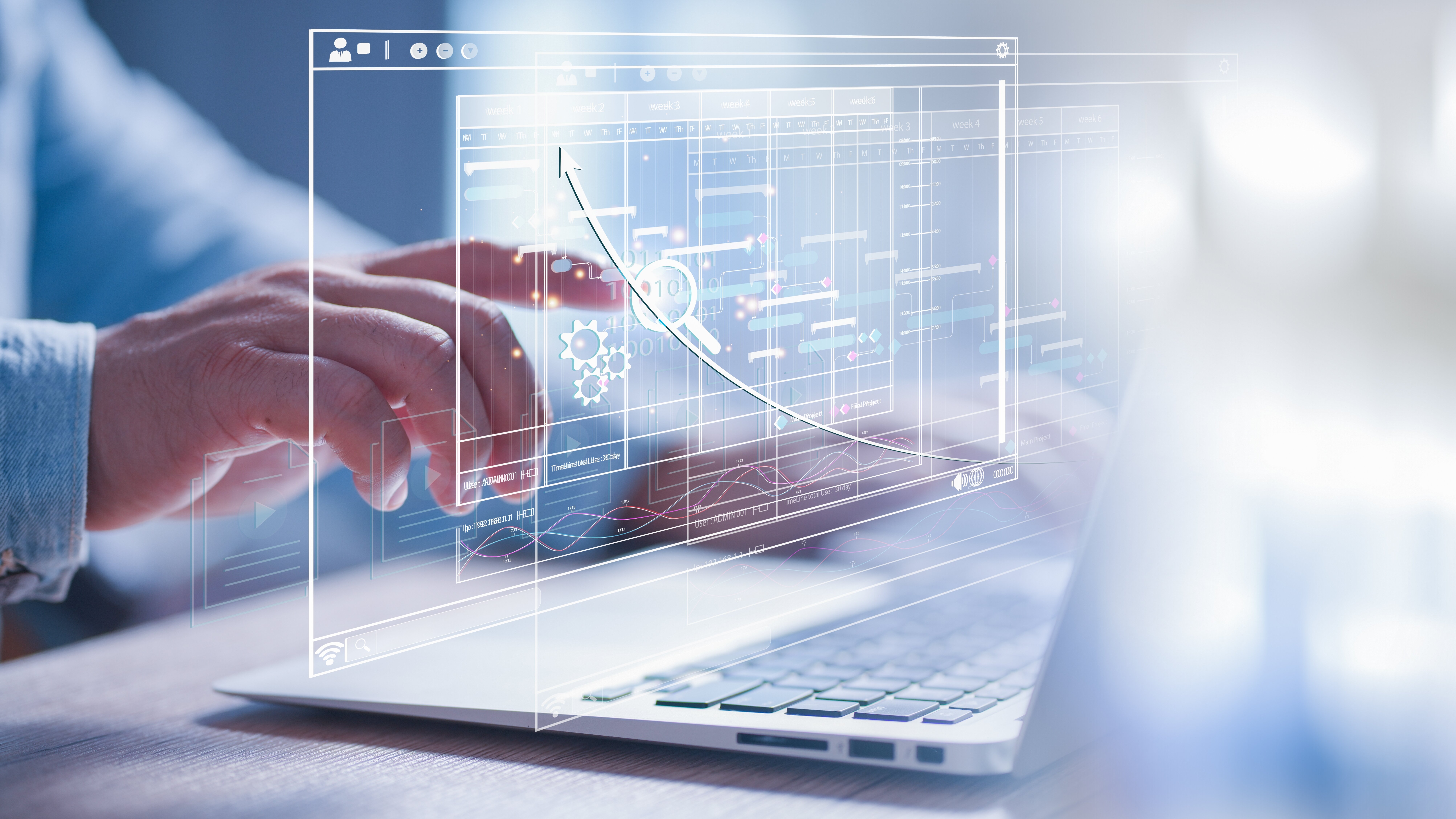 finger in front of laptop points to holographic statistics